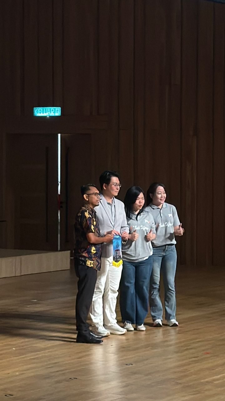 Team members invited on stage at a Xiamen University Malaysia campus event
