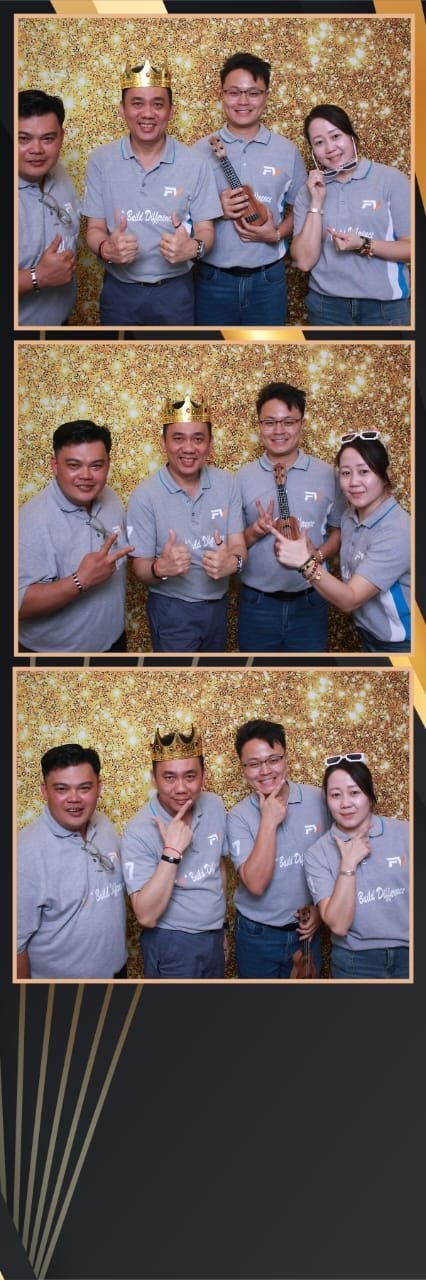 Team celebrating together at a photo booth